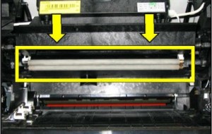 Charge roller is visible when the toner cartridge is removed and drops down from above the cartridge.